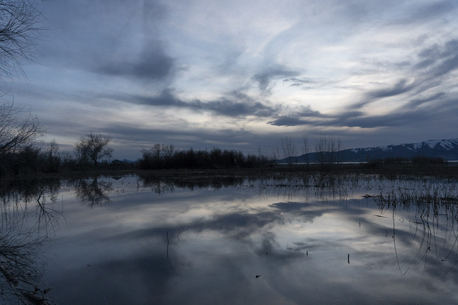 A near perfect reflection of slatey evening clouds in the lake